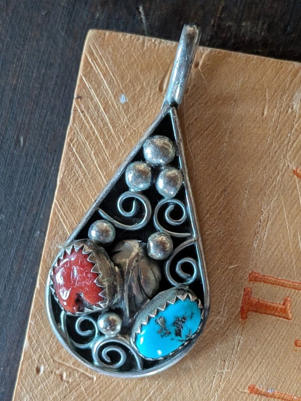 Sterling silver pendant with coral and turquoise colored stones